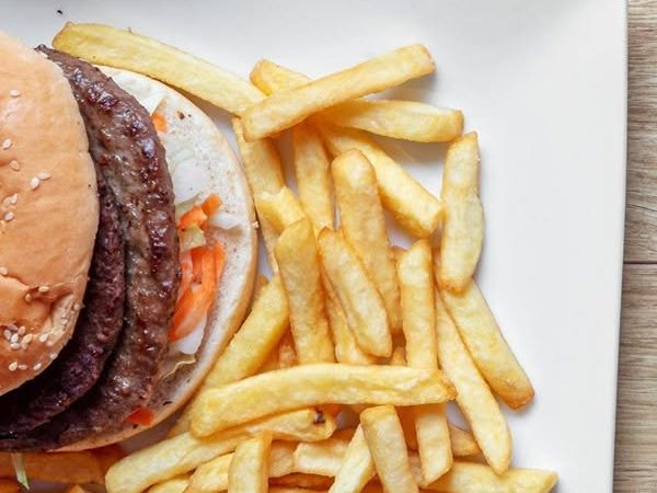 Beef burger served with a portion of chips