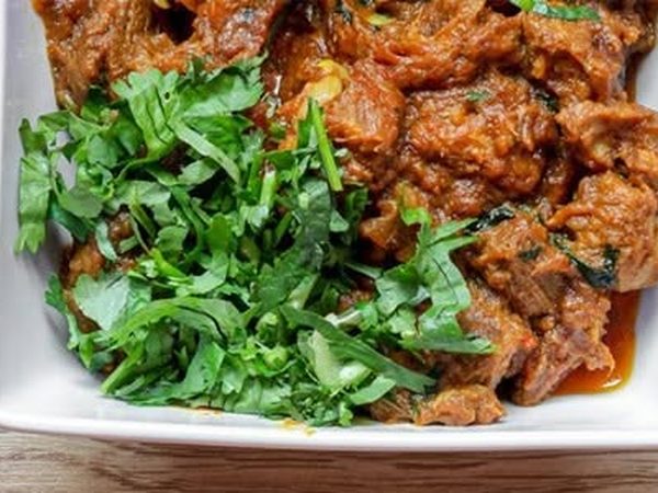 Lamb balti curry topped with fresh coriander