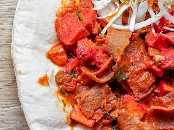 Doner and chicken tikka kebab on naan bread with salad